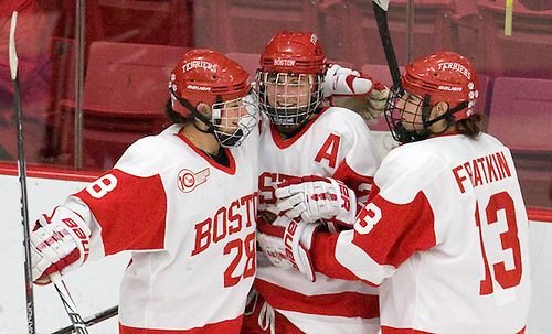 Louise Warren (BU - 28), Marie-Philip Poulin (BU - 29) and Kaleigh Fratkin (BU - 13) celebrate Poulin
